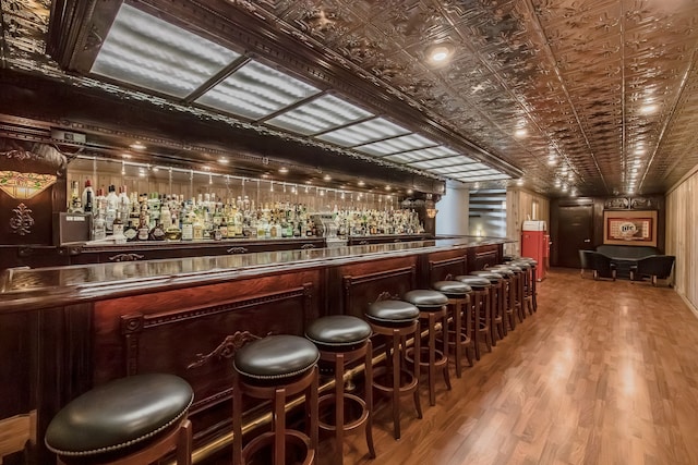 bar featuring hardwood / wood-style floors