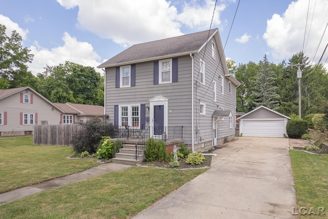 view of front of house with a garage, a front lawn, and an outdoor structure