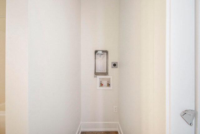 laundry area with hookup for a washing machine and hookup for an electric dryer