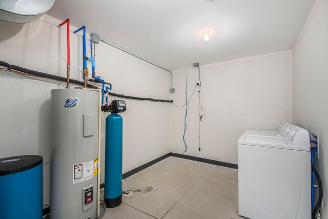 utility room featuring independent washer and dryer and water heater