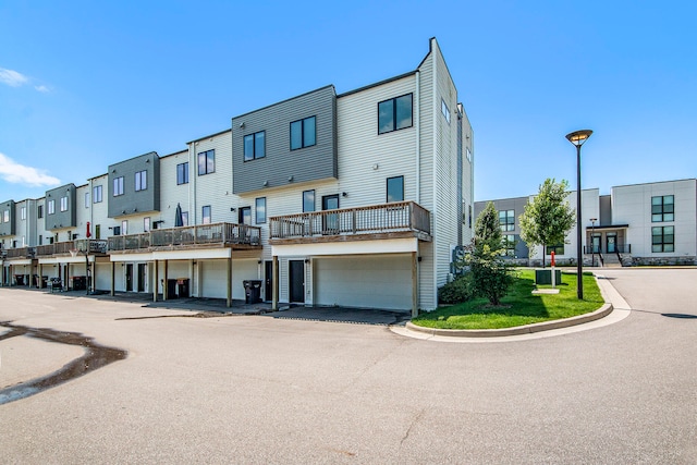 exterior space featuring a garage and central air condition unit