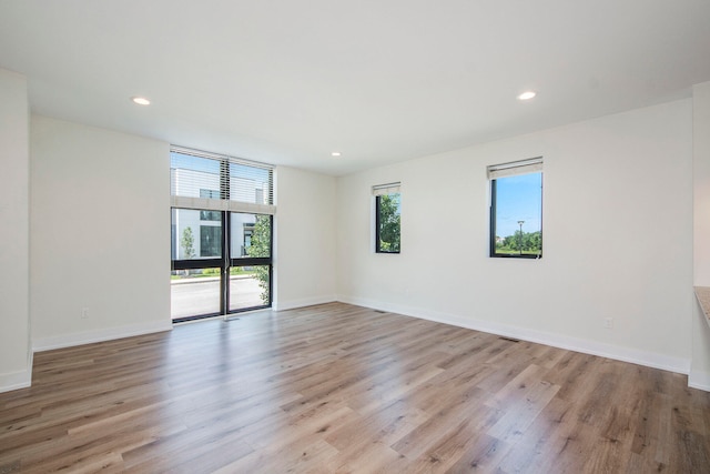 spare room featuring light hardwood / wood-style flooring