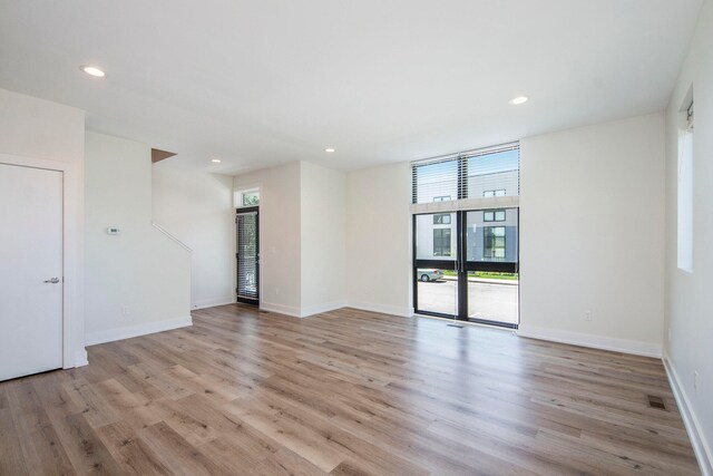 unfurnished room featuring light hardwood / wood-style floors