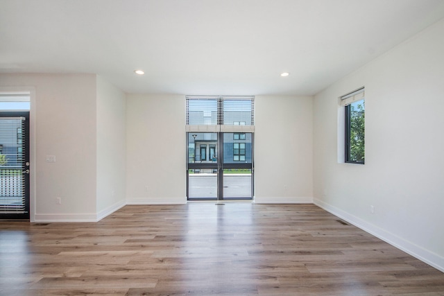 unfurnished room with light hardwood / wood-style flooring