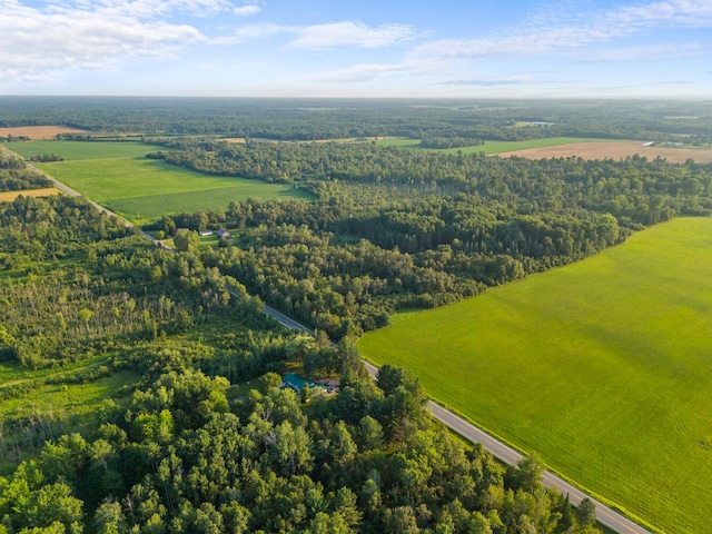 birds eye view of property with a rural view