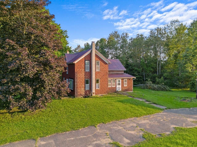 view of home's exterior featuring a lawn