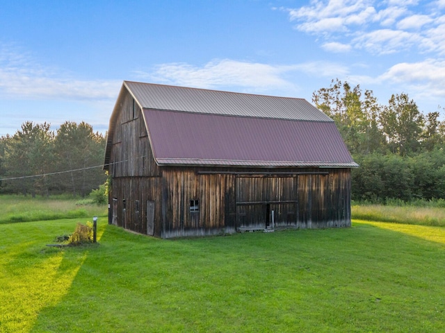 view of outdoor structure with a lawn