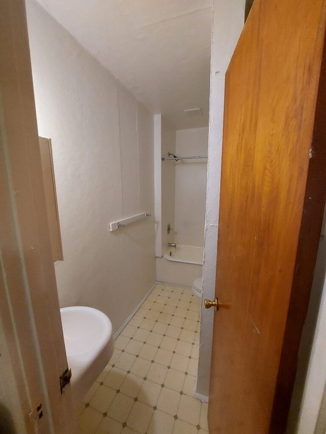 bathroom with tile patterned flooring and bathing tub / shower combination