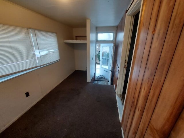 hallway with dark carpet