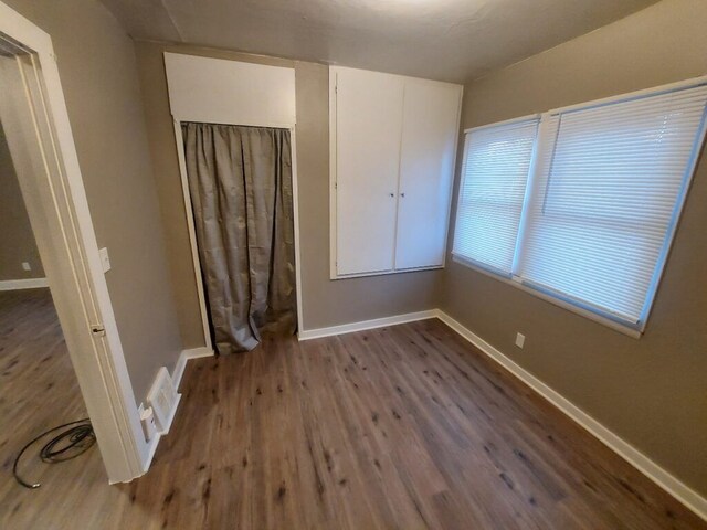 spare room featuring hardwood / wood-style floors