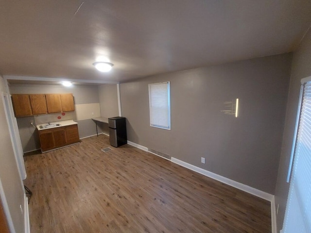 interior space featuring hardwood / wood-style floors and fridge