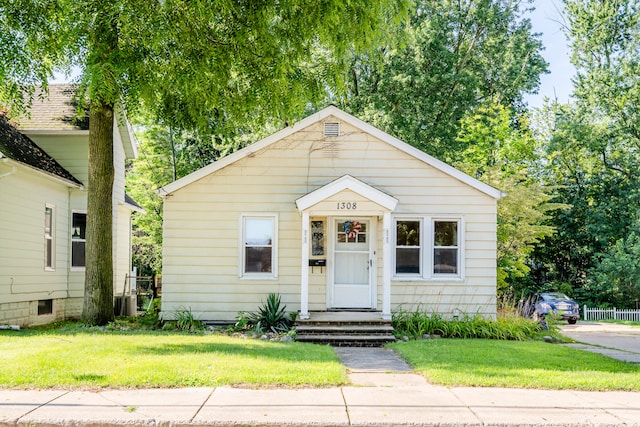 bungalow with a front lawn