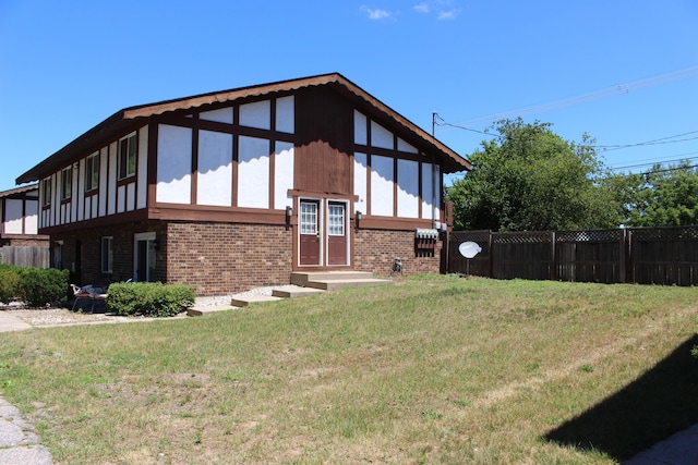 view of property exterior with a yard