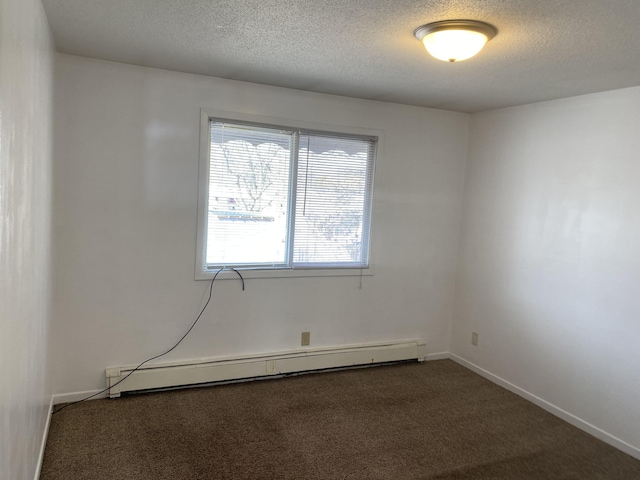 carpeted empty room featuring a textured ceiling and a baseboard radiator