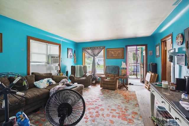 living room with light hardwood / wood-style floors and cooling unit