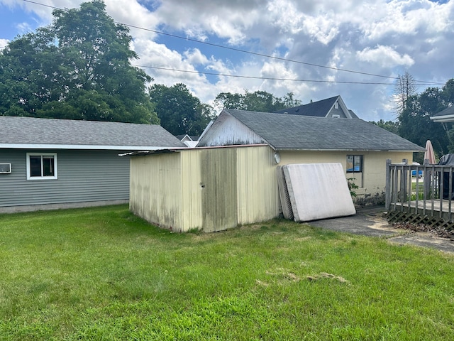 view of outdoor structure with a lawn