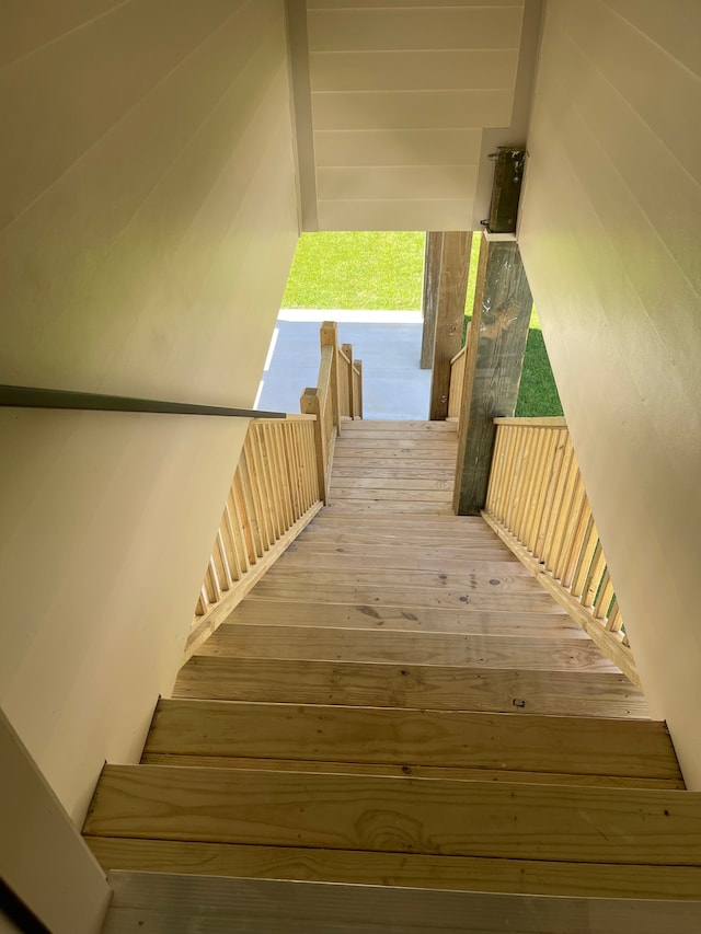 staircase featuring hardwood / wood-style flooring