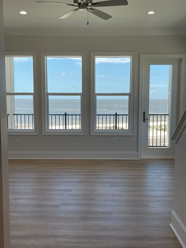 996 W Beach Blvd, Mississippi, MS 39560 - unfurnished room with wood finished floors, ceiling fan, a water view, ornamental molding, and recessed lighting