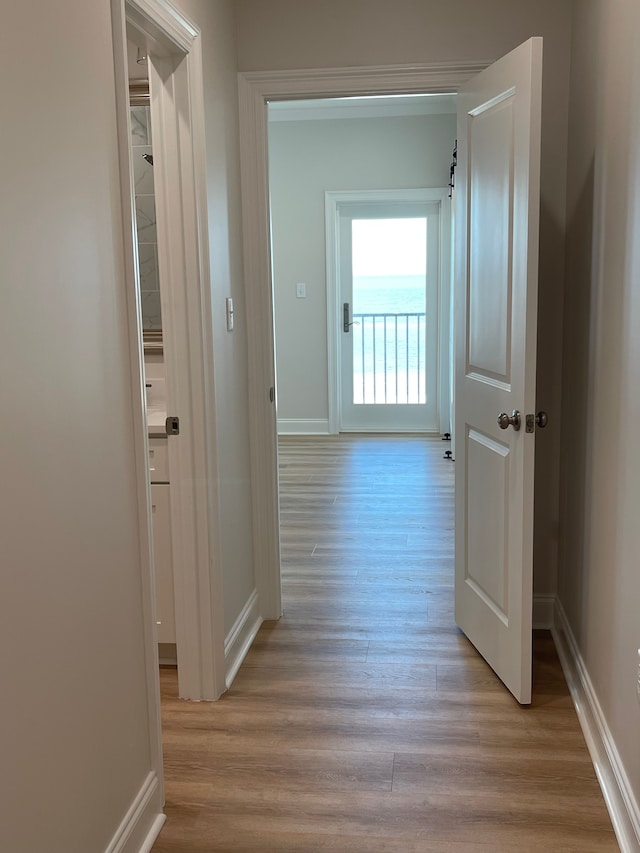 hall with light hardwood / wood-style flooring