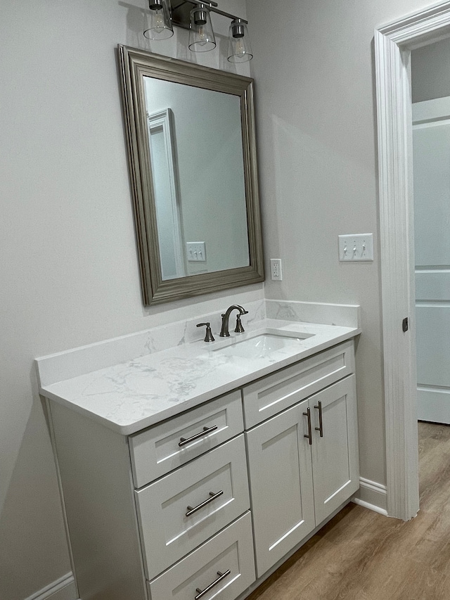 bathroom featuring vanity and hardwood / wood-style flooring