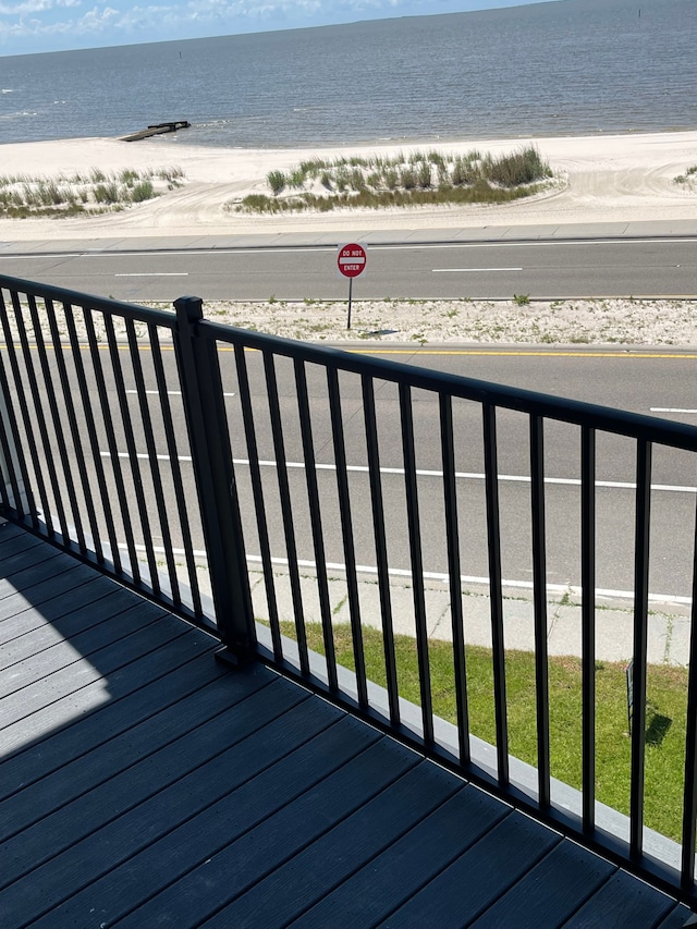 balcony with a beach view and a water view