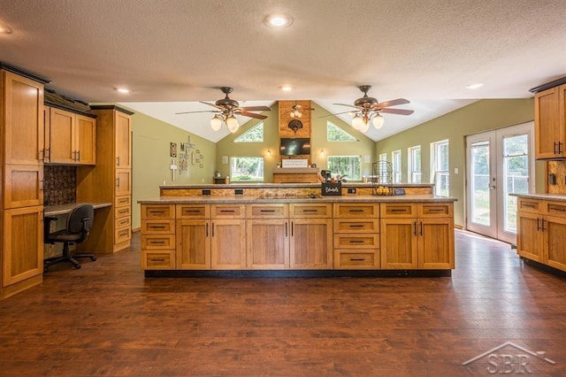 kitchen with dark hardwood / wood-style flooring, lofted ceiling, a textured ceiling, and french doors