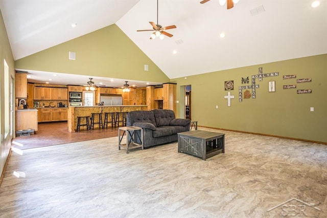 living room featuring light wood-type flooring and high vaulted ceiling