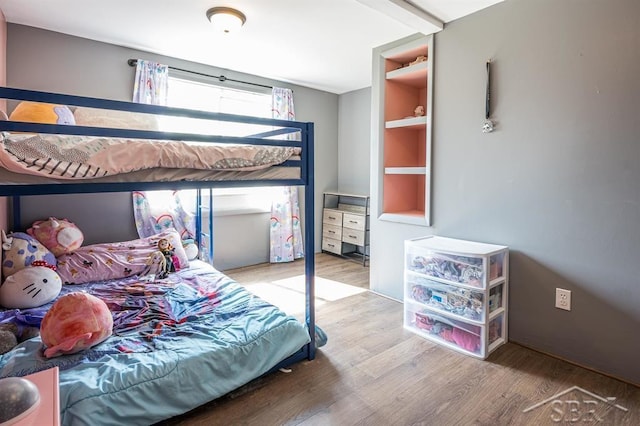 bedroom featuring wood-type flooring