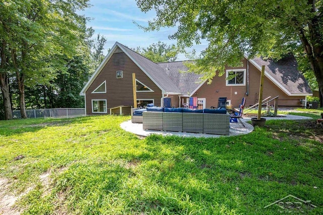 back of property with an outdoor hangout area, a patio area, and a lawn