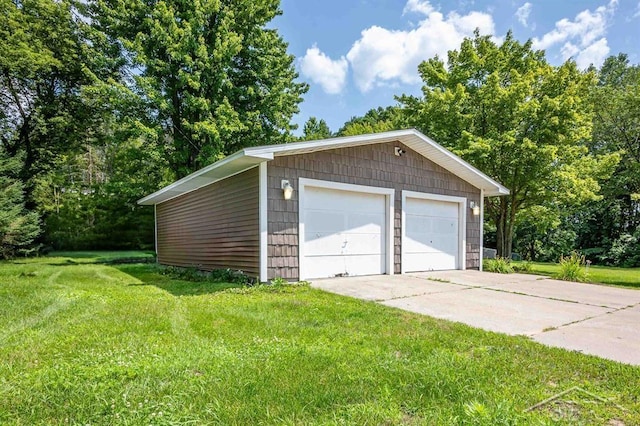 garage featuring a lawn