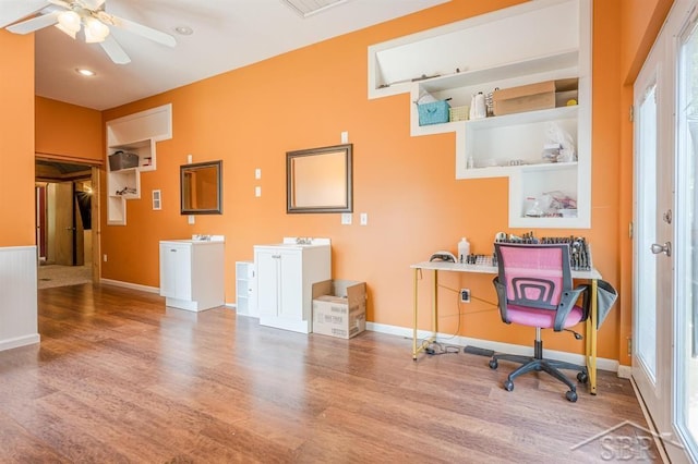 office area with hardwood / wood-style flooring, plenty of natural light, and ceiling fan