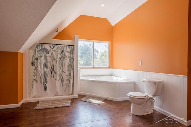 bathroom featuring shower with separate bathtub, hardwood / wood-style flooring, toilet, and lofted ceiling