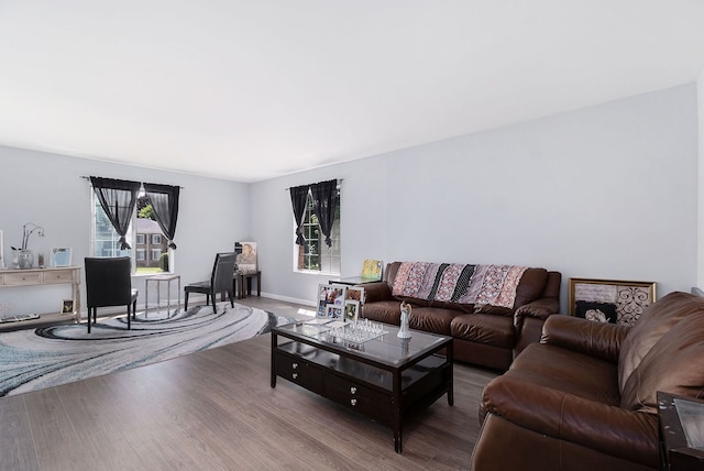 654 E Fox Hills Dr, Bloomfield Hills, MI 48304 - living area with wood finished floors, healthy amount of natural light, and baseboards