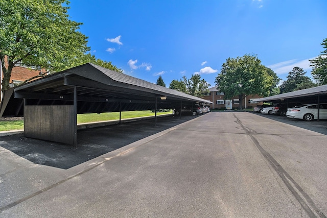 view of vehicle parking featuring a carport