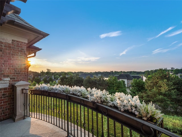 view of balcony at dusk