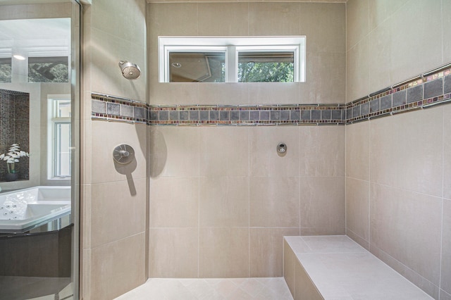 bathroom with tiled shower