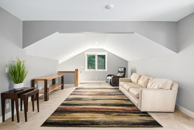 carpeted living room with lofted ceiling