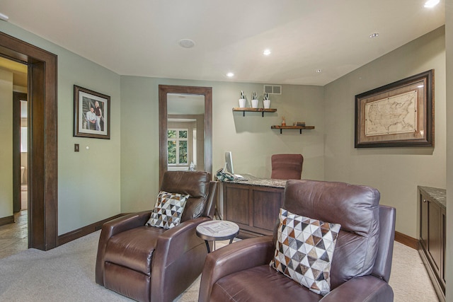 living area featuring light colored carpet