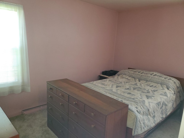 bedroom with carpet flooring and baseboard heating