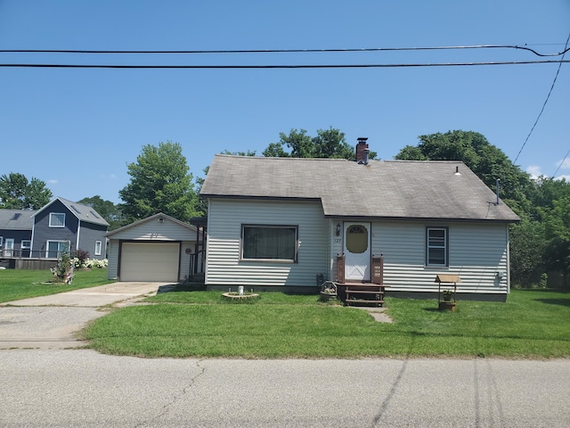 view of front facade with an outbuilding, a front lawn, a chimney, and a garage