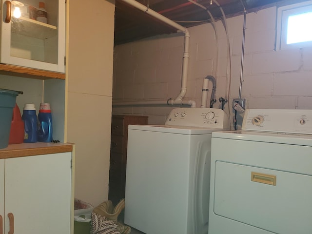 washroom featuring laundry area and washer and dryer