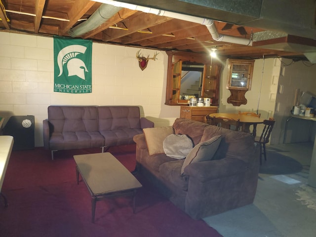 living area with concrete floors