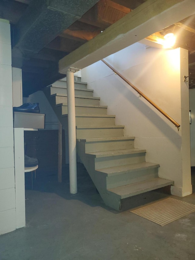 finished basement featuring stairs