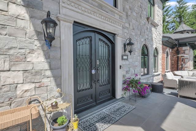 doorway to property featuring french doors and an outdoor hangout area