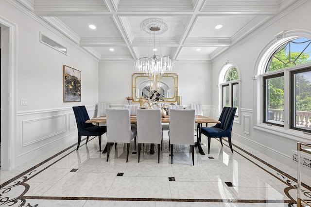 dining room featuring a notable chandelier, beam ceiling, crown molding, and coffered ceiling