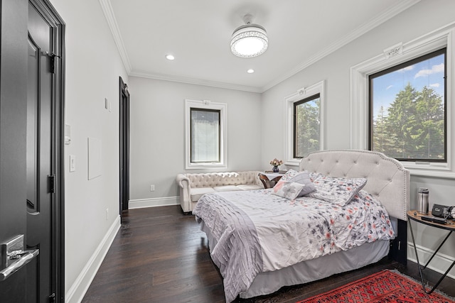 bedroom with crown molding and dark hardwood / wood-style flooring