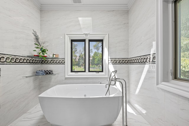 bathroom with plenty of natural light, ornamental molding, and tile walls