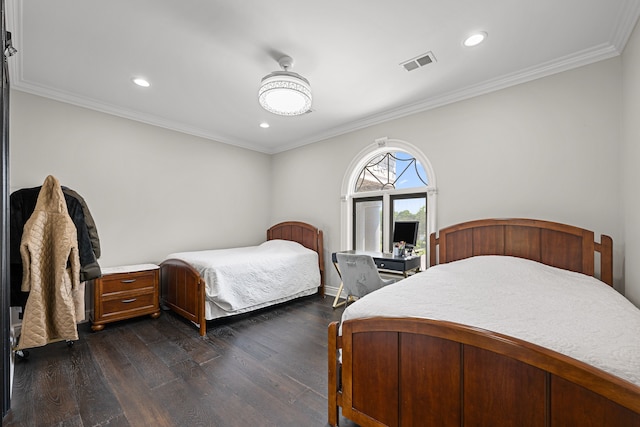 bedroom featuring crown molding and dark hardwood / wood-style flooring