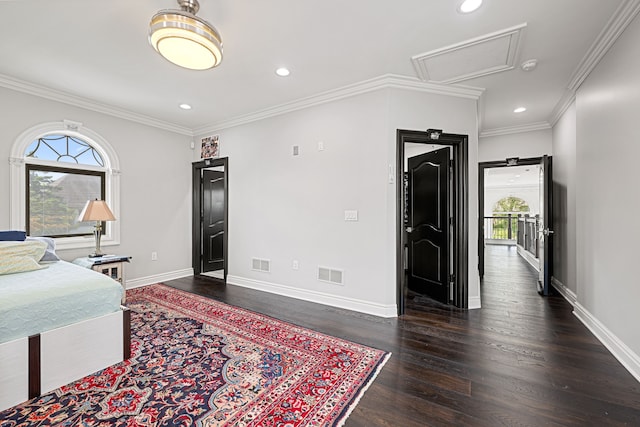 bedroom featuring crown molding and dark wood-type flooring