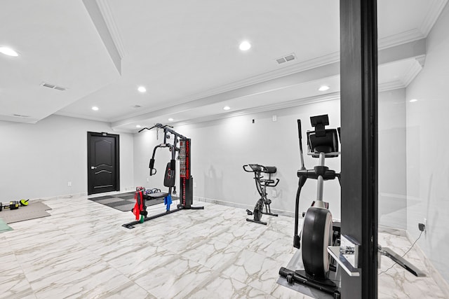 exercise room featuring crown molding